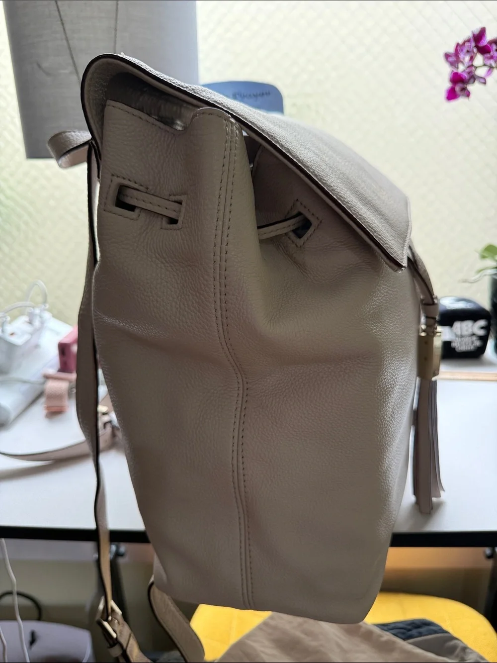 kate spade Pebbled Cream Leather Backpack with Tassel Accents